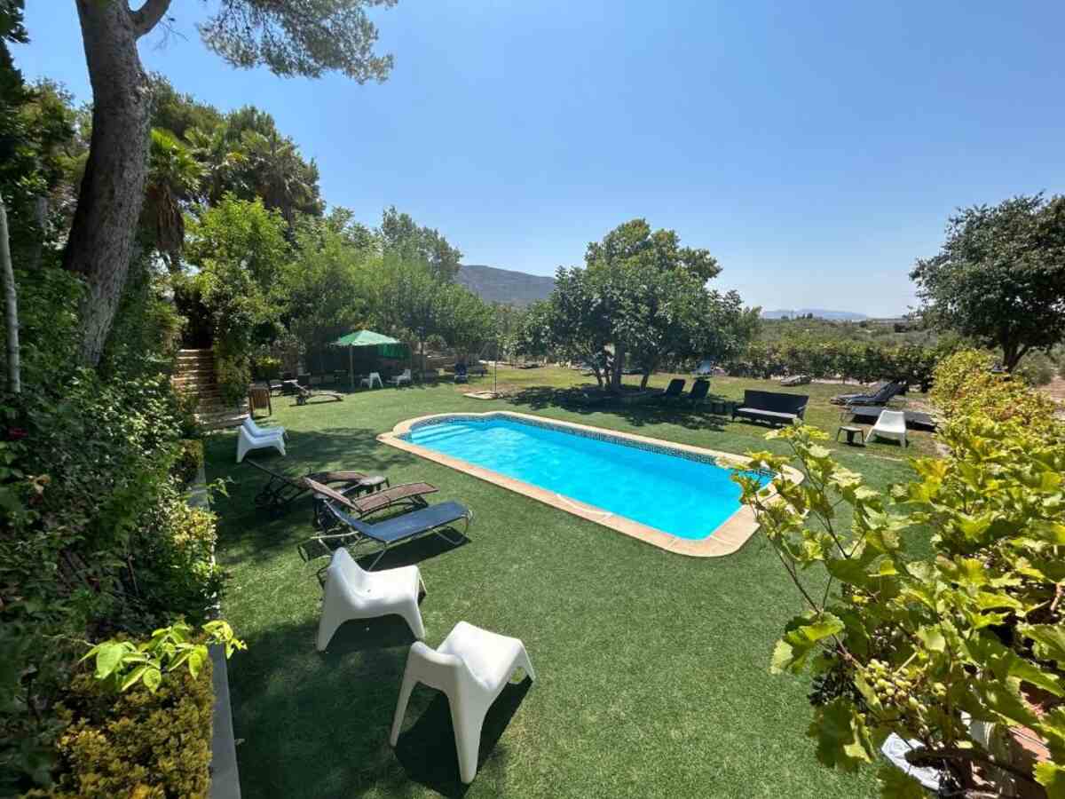 Outdoor swimming pool in the garden of Hotel FINCA FANECAES